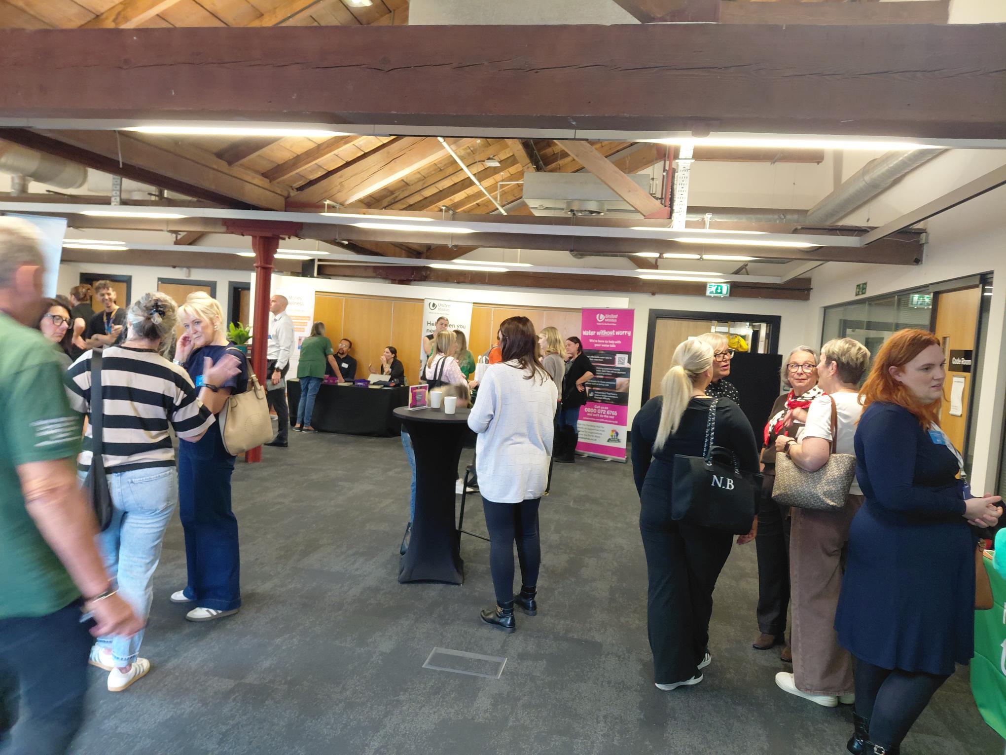 Affordability summit in progress. Features various stalls, visitors and colleges. 