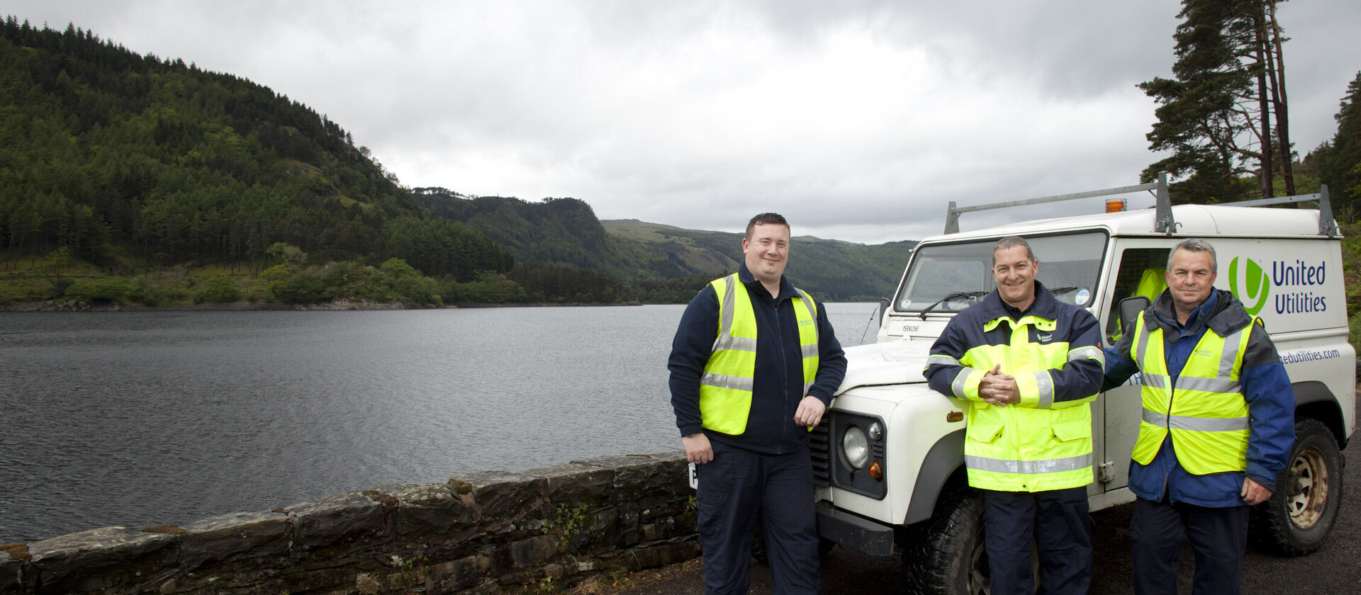 United Utilities employees gathered at a lake