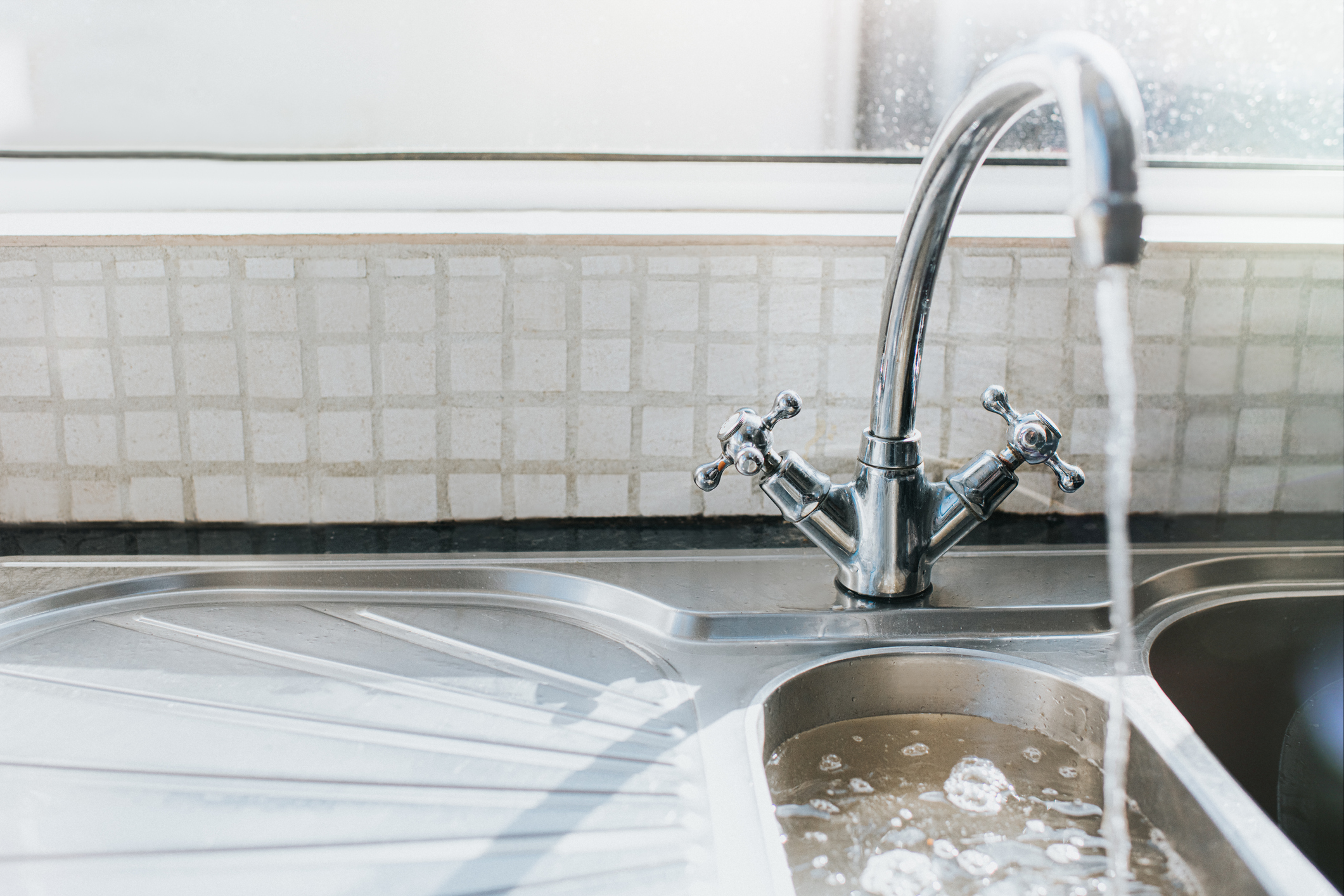 Water pouring out tap